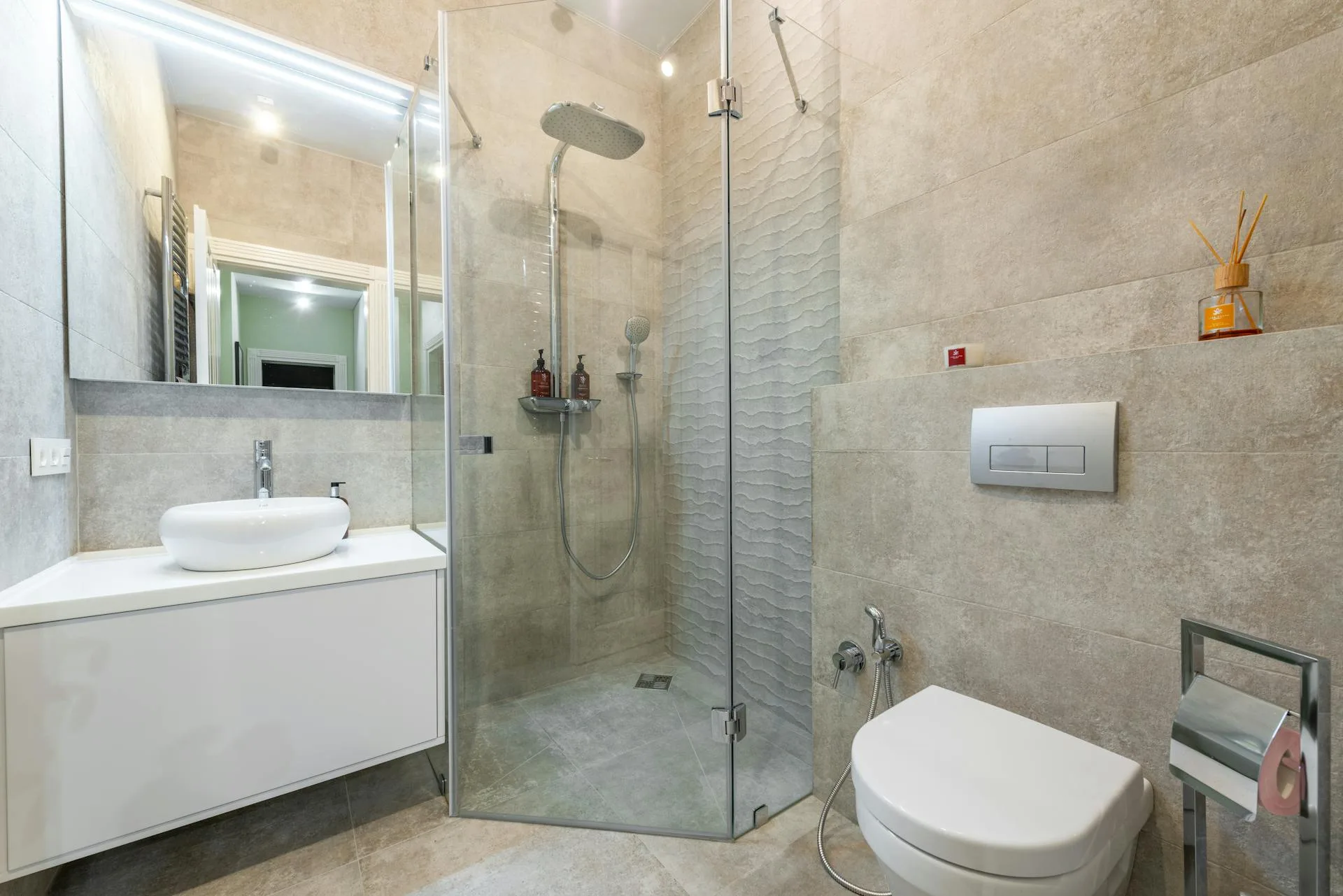 Contemporary shower room with glass screen and clean tiling